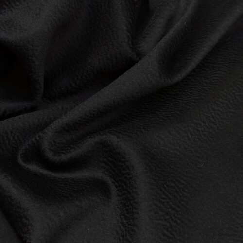 High-quality wool blend with a cashmere-like hand. Deep black color, soft pile, and compact construction ideal for classic coats.